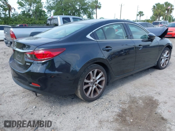 2016 Mazda Mazda6 i Touring with VIN JM1GJ1V53G1431880, listed as a IAAI auction lot 42079970 with 111,179 mi miles. Bid and sale history available at carsss.com. Image 4.
