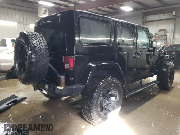 2015 Jeep Wrangler Unlimited Rubicon Hard Rock with VIN 1C4HJWFG4FL676868, listed as a Copart auction lot 48489525 with 100,771 mi miles and Salvage title. Bid and sale history available at DreamBid. Image 3.