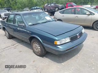 1994 Oldsmobile Cutlass Ciera S z VIN 1G3AG55M3R6441530, wystawiony jako IAAI lot #42404529 z przebiegiem 78 518 mil mil oraz . Historia ofert i sprzedaży dostępna na DreamBid. Obrazek 1.