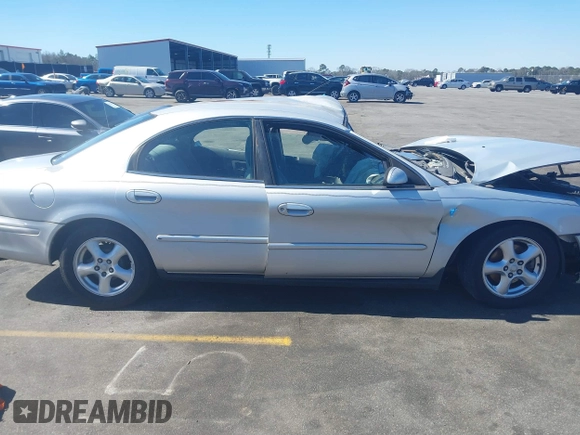 2003 Mercury Sable GS z VIN 1MEFM50U83A608330, wystawiony jako IAAI lot #41652880 z przebiegiem 218 651 mil mil oraz . Historia ofert i sprzedaży dostępna na DreamBid. Obrazek 13.
