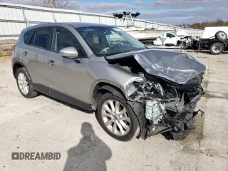 2013 Mazda CX-5 Grand Touring with VIN JM3KE4DE8D0102280, listed as a Copart auction lot 79750774 with 151,797 mi miles and Salvage Title. Bid and sale history available at DreamBid. Image 4.