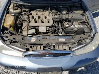 2000 Ford Contour SE Fleet z VIN 1FAFP66L8YK104588, wystawiony jako Copart lot #71769314 z przebiegiem 106 163 mil mil oraz Szkody całkowita. Historia ofert i sprzedaży dostępna na DreamBid. Obrazek 13.