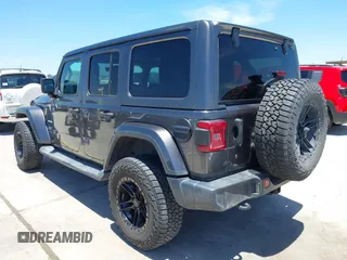 2018 Jeep Wrangler Unlimited Sahara with VIN 1C4HJXEN1JW236779, listed as a IAAI auction lot 42238158 with 72,879 mi miles and . Bid and sale history available at DreamBid. Image 3.