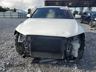 2016 Audi Q3 Prestige with VIN WA1FFCFS0GR007940, listed as a Copart auction lot 57384685 with 61,336 mi miles and Salvage title. Bid and sale history available at DreamBid. Image 5.