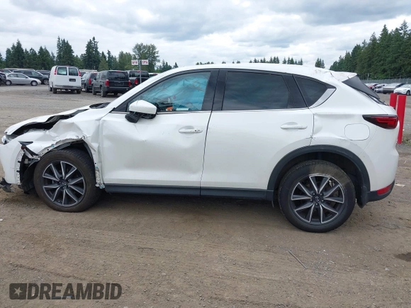 2018 Mazda CX-5 Grand Touring with VIN JM3KFBDM1J0382306, listed as a IAAI auction lot 42554947 with 121,303 mi miles and . Bid and sale history available at DreamBid. Image 14.