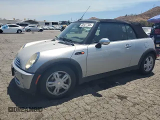2006 MINI Convertible with VIN WMWRF33576TG16056, listed as a Copart auction lot 63127705 with 108,654 mi miles and Salvage title. Bid and sale history available at DreamBid. Image 1.