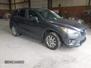 2015 Mazda CX-5 Touring with VIN JM3KE4CY6F0510002, listed as a IAAI auction lot 42045284 with 88,949 mi miles and . Bid and sale history available at DreamBid. Image 1.