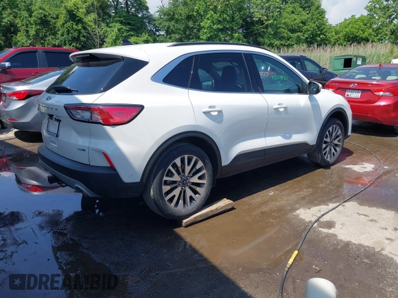 2020 Ford Escape Titanium z VIN 1FMCU9J90LUA39747, wystawiony jako IAAI lot #42369890 z przebiegiem 31 425 mil mil oraz . Historia ofert i sprzedaży dostępna na DreamBid. Obrazek 4.