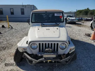 2000 Jeep Wrangler Sahara with VIN 1J4FA59SXYP764539, listed as a Copart auction lot 52707385 with 136,159 mi miles and Salvage title. Bid and sale history available at DreamBid. Image 5.