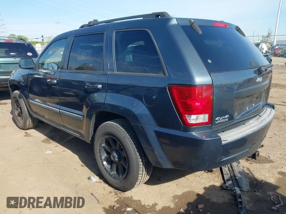2007 Jeep Grand Cherokee Laredo with VIN 1J8GR48K77C582875, listed as a IAAI auction lot 42061653 with 259,767 mi miles. Bid and sale history available at carsss.com. Image 3.