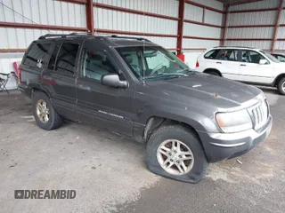 2004 Jeep Grand Cherokee Laredo with VIN 1J4GW48S94C218267, listed as a IAAI auction lot 41977405 with 230,985 mi miles. Bid and sale history available at carsss.com. Image 1.
