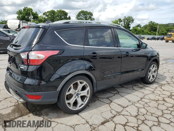 2018 Ford Escape Titanium with VIN 1FMCU0J92JUC84901, listed as a Copart auction lot 60428635 with 69,210 mi miles and Salvage title. Bid and sale history available at DreamBid. Image 3.