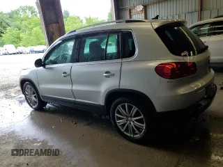 2013 Volkswagen Tiguan SE with VIN WVGBV7AX1DW504036, listed as a Copart auction lot 61126145 with 148,399 mi miles and Salvage title. Bid and sale history available at DreamBid. Image 2.