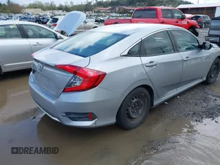 2019 Honda Civic LX with VIN 19XFC2F61KE009471, listed as a IAAI auction lot 42017532 with 81,134 mi miles and . Bid and sale history available at DreamBid. Image 4.
