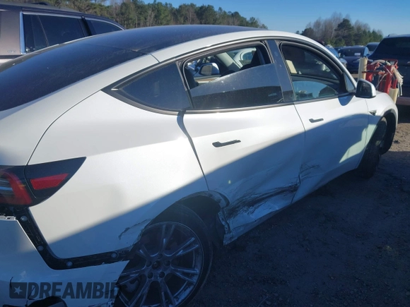 2023 Tesla Model Y Long Range with VIN 7SAYGAEE3PF753657, listed as a IAAI auction lot 41668917 with 33,301 mi miles and . Bid and sale history available at DreamBid. Image 24.