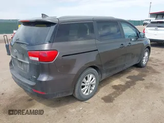 2015 Kia Sedona LX with VIN KNDMB5C13F6072586, listed as a IAAI auction lot 42090232 with 125,818 mi miles. Bid and sale history available at carsss.com. Image 4.