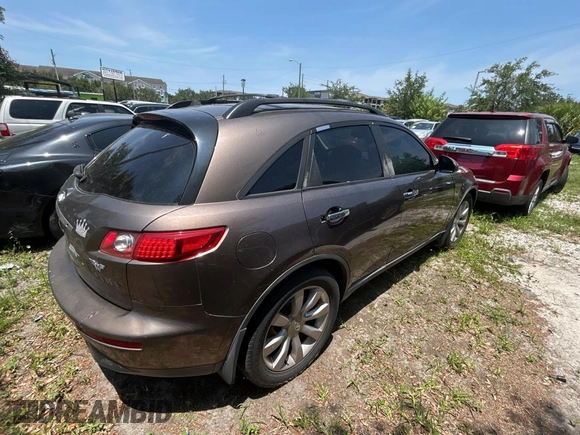2003 Infiniti FX Options z VIN JNRAS08W93X205643, wystawiony jako Copart lot #58410885 z przebiegiem 210 110 mil mil oraz Tytuł czysty. Historia ofert i sprzedaży dostępna na DreamBid. Obrazek 4.