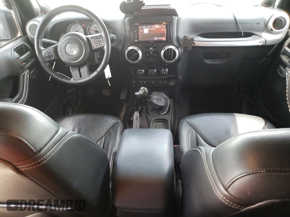 2013 Jeep Wrangler Unlimited Rubicon 10th Anniversary with VIN 1C4HJWFGXDL543660, listed as a Copart auction lot 61462104 with 115,897 mi miles and Salvage title. Bid and sale history available at DreamBid. Image 8.