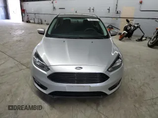 2018 Ford Focus SE z VIN 1FADP3FE0JL239152, wystawiony jako Copart lot #56789355 z przebiegiem 148 802 mil mil oraz Czysty tytuł • Clean title. Historia ofert i sprzedaży dostępna na DreamBid. Obrazek 5.