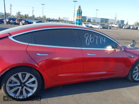 2018 Tesla Model 3 Long Range Battery with VIN 5YJ3E1EA3JF035785, listed as a IAAI auction lot 41986774 with 33,965 mi miles and . Bid and sale history available at DreamBid. Image 13.