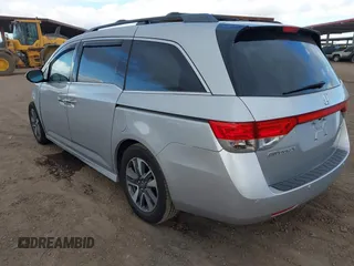 2014 Honda Odyssey Touring with VIN 5FNRL5H93EB066162, listed as a IAAI auction lot 41734783 with 173,063 mi miles and . Bid and sale history available at DreamBid. Image 3.