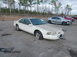 1996 Ford Thunderbird LX with VIN 1FALP62W4TH154400, listed as a IAAI auction lot 41394723 with 65,860 mi miles and . Bid and sale history available at DreamBid. Image 1.
