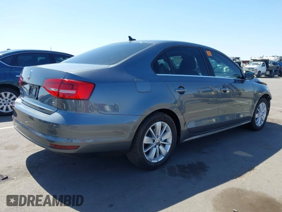 2015 Volkswagen Jetta SE with VIN 3VWD17AJ6FM406091, listed as a IAAI auction lot 42539626 with 82,005 mi miles and . Bid and sale history available at DreamBid. Image 4.