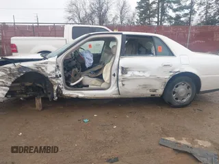 2002 Cadillac DeVille DHS z VIN 1G6KE57YX2U212020, wystawiony jako IAAI lot #41287342 z przebiegiem Nie podano mil oraz . Historia ofert i sprzedaży dostępna na DreamBid. Obrazek 14.