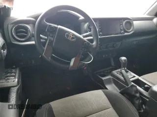 2023 Toyota Tacoma SR with VIN 3TMCZ5AN4PM566647, listed as a Copart auction lot 64062034 with 43,154 mi miles and Salvage title. Bid and sale history available at DreamBid. Image 8.
