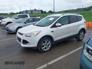 2016 Ford Escape Titanium with VIN 1FMCU9JX4GUB72080, listed as a IAAI auction lot 42519240 with 121,793 mi miles and . Bid and sale history available at DreamBid. Image 2.