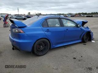 2015 Mitsubishi Lancer Evolution GSR z VIN JA32W8FV7FU023106, wystawiony jako Copart lot #40867084 z przebiegiem 103 964 mil mil oraz Szkody całkowita. Historia ofert i sprzedaży dostępna na DreamBid. Obrazek 3.