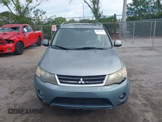 2007 Mitsubishi Outlander XLS z VIN JA4MS41X57Z016273, wystawiony jako IAAI lot #38897236 z przebiegiem 165 376 mil mil oraz . Historia ofert i sprzedaży dostępna na DreamBid. Obrazek 12.