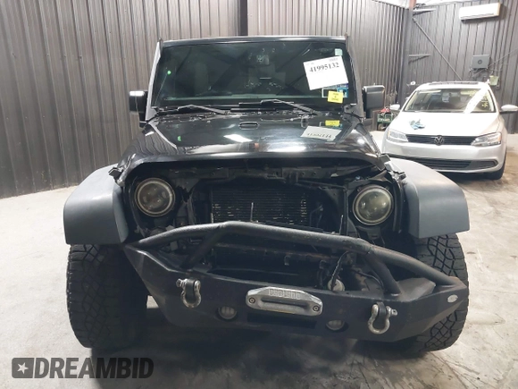 2015 Jeep Wrangler Unlimited Willys Wheeler with VIN 1C4BJWDG1FL749803, listed as a IAAI auction lot 41995132 with 156,595 mi miles and . Bid and sale history available at DreamBid. Image 13.