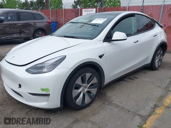 2023 Tesla Model Y Long Range with VIN 7SAYGAEE9PF702910, listed as a IAAI auction lot 42199519 with 91,094 mi miles and . Bid and sale history available at DreamBid. Image 2.