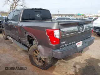 2016 Nissan Titan XD PRO-4X with VIN 1N6BA1F47GN504416, listed as a IAAI auction lot 41223650 with 168,440 mi miles. Bid and sale history available at carsss.com. Image 3.