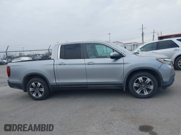 2019 Honda Ridgeline RTL with VIN 5FPYK2F50KB004055, listed as a IAAI auction lot 41576975 with 128,620 mi miles and . Bid and sale history available at DreamBid. Image 13.