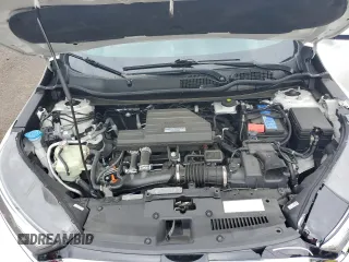 2020 Honda CR-V Touring z VIN 2HKRW2H90LH645727, wystawiony jako Copart lot #62077365 z przebiegiem 58 614 mil mil oraz Szkoda całkowita • Salvage title. Historia ofert i sprzedaży dostępna na DreamBid. Obrazek 11.