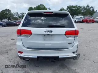 2014 Jeep Grand Cherokee Summit z VIN 1C4RJEJG1EC357948, wystawiony jako IAAI lot #42498652 z przebiegiem 213 715 mil mil oraz . Historia ofert i sprzedaży dostępna na DreamBid. Obrazek 16.