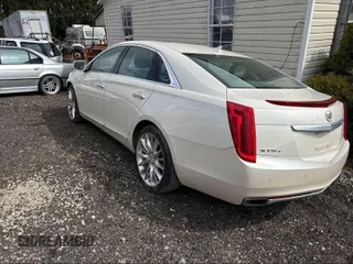 2013 Cadillac XTS Platinum z VIN 2G61V5S33D9173441, wystawiony jako IAAI lot #41902672 z przebiegiem 103 044 mil mil oraz . Historia ofert i sprzedaży dostępna na DreamBid. Obrazek 3.