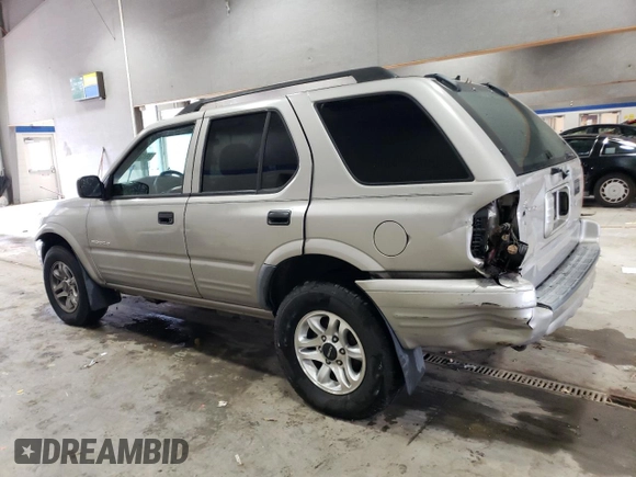 2004 Isuzu Rodeo S z VIN 4S2CK58W144306785, wystawiony jako Copart lot #85124684 z przebiegiem 296 433 mil mil oraz Szkody całkowita. Historia ofert i sprzedaży dostępna na DreamBid. Obrazek 2.