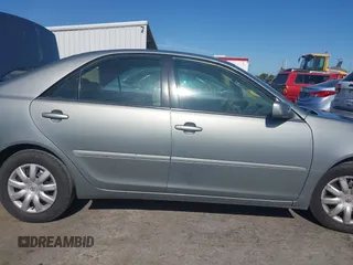 2005 Toyota Camry LE z VIN 4T1BE30K65U592500, wystawiony jako IAAI lot #42373718 z przebiegiem 189 054 mil mil oraz . Historia ofert i sprzedaży dostępna na DreamBid. Obrazek 13.