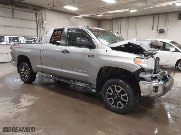 2014 Toyota Tundra 4WD Truck SR with VIN 5TFUY5F17EX357035, listed as a IAAI auction lot 39928076 with 129,831 mi miles. Bid and sale history available at carsss.com. Image 1.