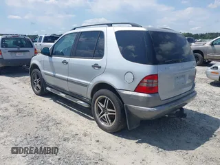 1998 Mercedes-Benz M-Class with VIN 4JGAB54E3WA031579, listed as a IAAI auction lot 42004335 with 156,898 mi miles. Bid and sale history available at carsss.com. Image 3.