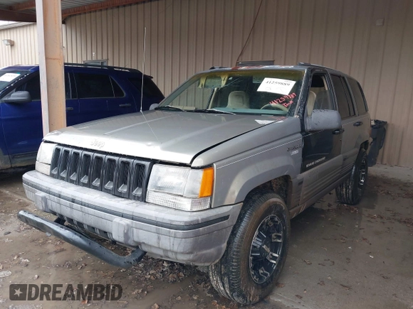 1995 Jeep Grand Cherokee Laredo with VIN 1J4GZ58SXSC697003, listed as a IAAI auction lot 41259889 with 248,595 mi miles. Bid and sale history available at carsss.com. Image 2.