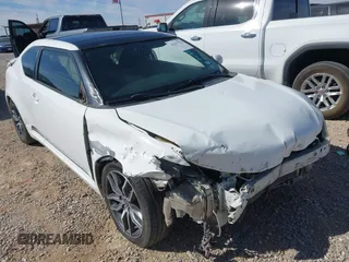 2014 Scion tC with VIN JTKJF5C7XE3074601, listed as a IAAI auction lot 41637532 with 121,700 mi miles. Bid and sale history available at carsss.com. Image 1.