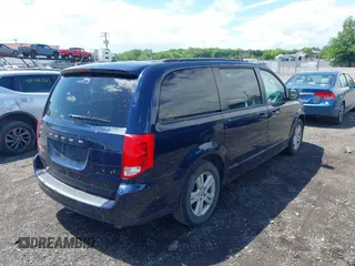 2012 Dodge Grand Caravan SXT with VIN 2C4RDGCGXCR277505, listed as a IAAI auction lot 42194492 with 206,565 mi miles and . Bid and sale history available at DreamBid. Image 4.