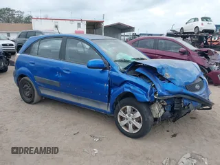 2009 Kia Rio LX with VIN KNADE243296494243, listed as a IAAI auction lot 41307888 with 133,487 mi miles. Bid and sale history available at carsss.com. Image 1.