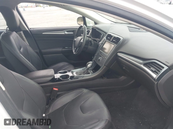 2013 Ford Fusion Titanium Hybrid with VIN 3FA6P0RUXDR386675, listed as a IAAI auction lot 42013986 with 89,349 mi miles. Bid and sale history available at carsss.com. Image 5.