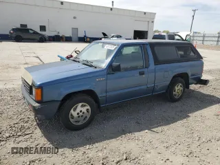 1989 Mitsubishi Mighty Max z VIN JA7FL24D7KP055207, wystawiony jako Copart lot #53172405 z przebiegiem 118 439 mil mil oraz Szkody całkowita. Historia ofert i sprzedaży dostępna na DreamBid. Obrazek 1.