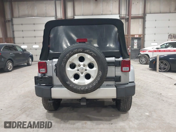 2014 Jeep Wrangler Unlimited Sahara with VIN 1C4BJWEG5EL164350, listed as a IAAI auction lot 42018586 with 113,222 mi miles. Bid and sale history available at carsss.com. Image 17.